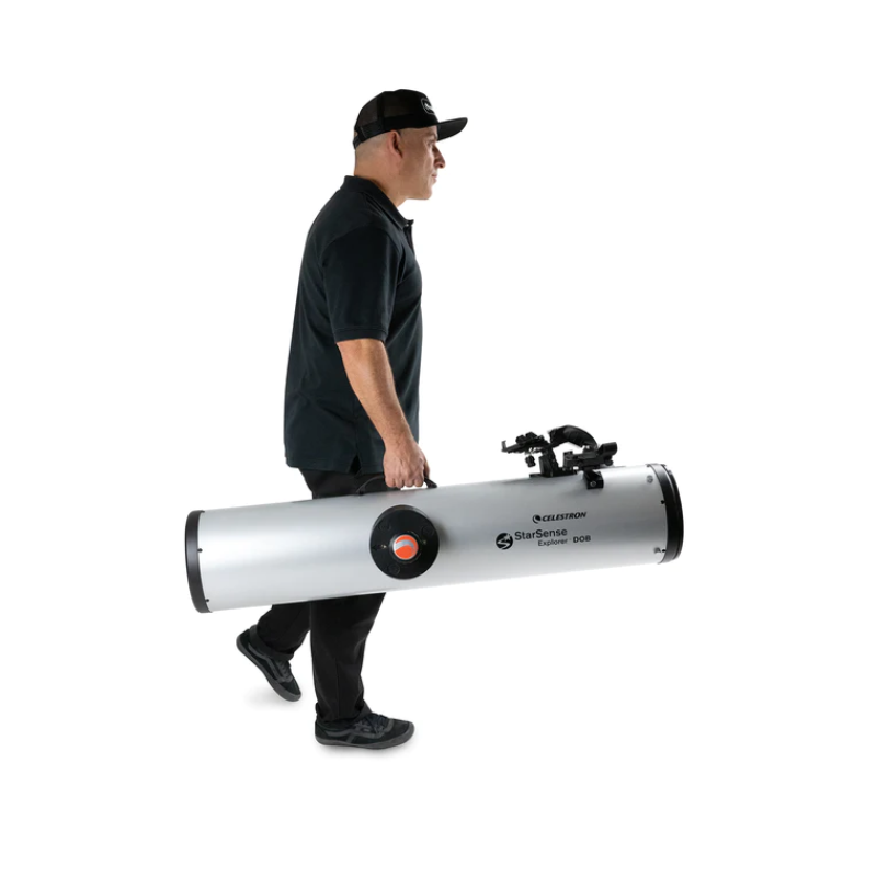 A man carrying the Starsense Explorer 8" Smartphone App-Enabled Dobsonian Telescope optical tube.