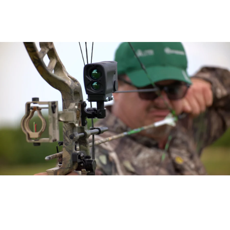 A man using Bresser 100 Yards Archery Laser Rangefinder attached to a hunting bow.