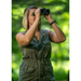 A woman using a pair of Alpen Wings 8x26 Binoculars.