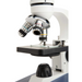 Celestron Labs CM1000C Compound Microscope slightly facing left focused on stage and objective lens.