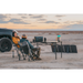 A couple out in the desert using BaseCharge 1500 and being charged by solar panels. 