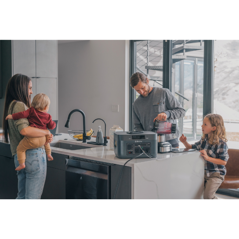 A family in the kitchen using a BaseCharge 1500.