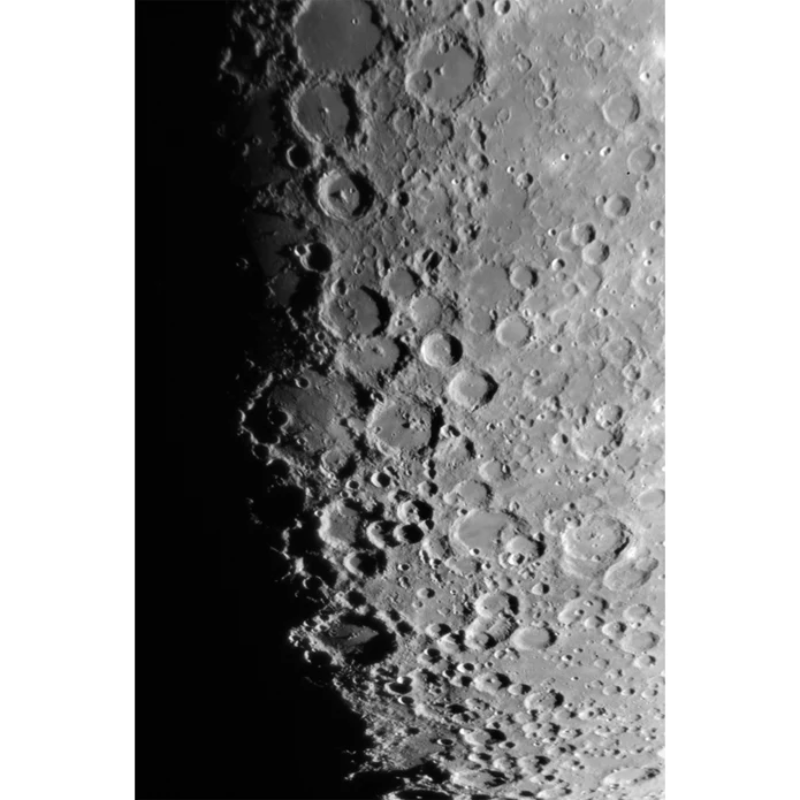 Image of the moon craters through Vixen AX103S Refractor ED Telescope.