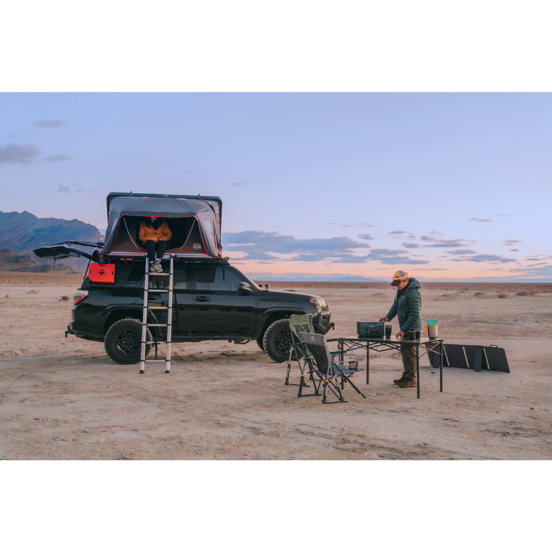 A couple out in the desert using a BaseCharge 1500.