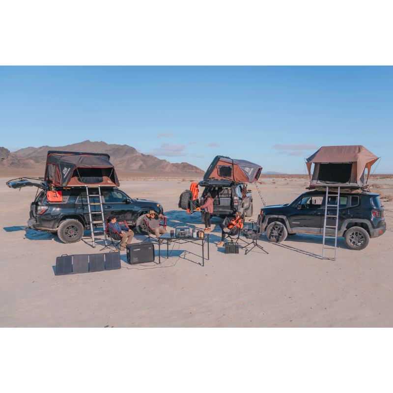 A group of campers out in the desert using a BaseCharge 1500.