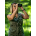 A woman using a pair of binoculars.